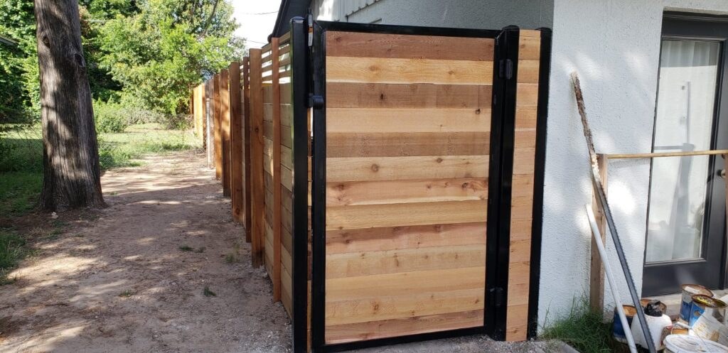 Cedar gate with a black metal frame