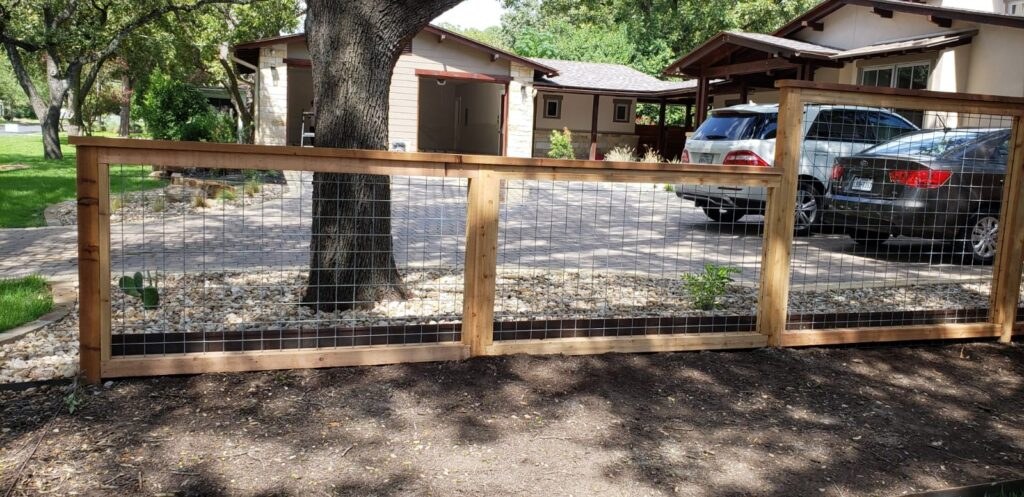 Wood rail farm fence along a driveway
