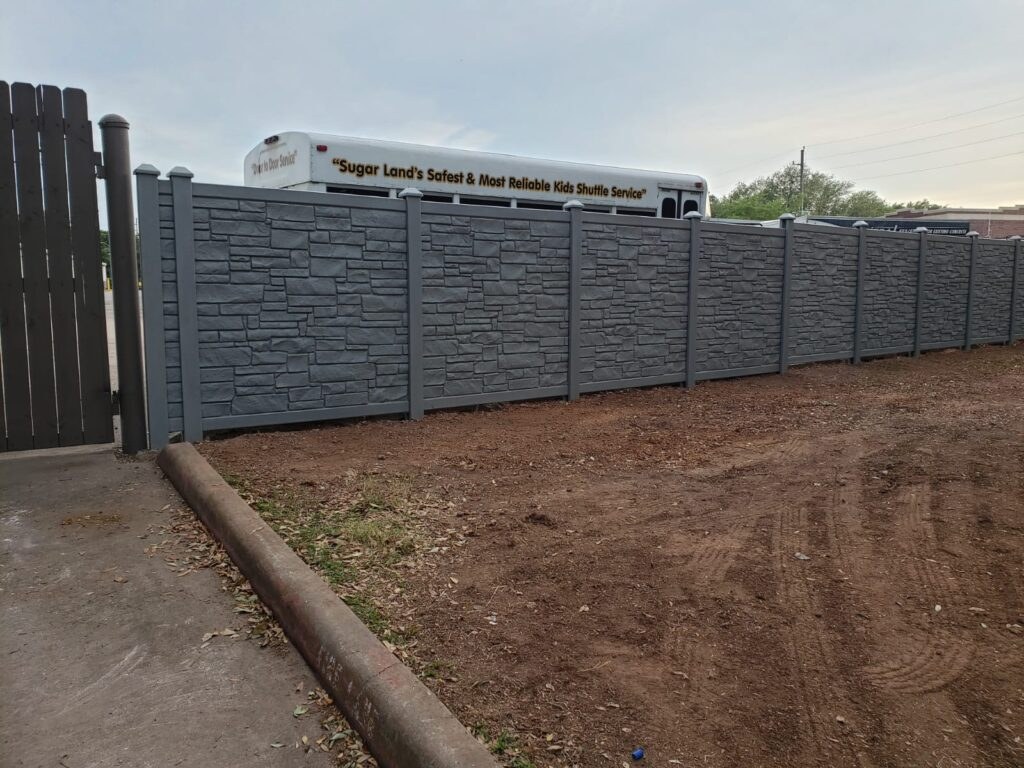 Long privacy fence run along a street