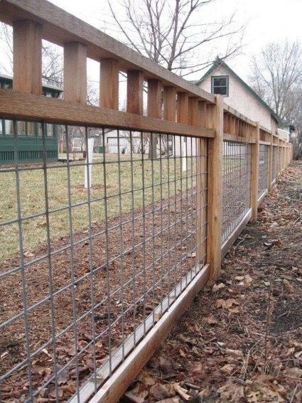 Wire panel fence alongside a home
